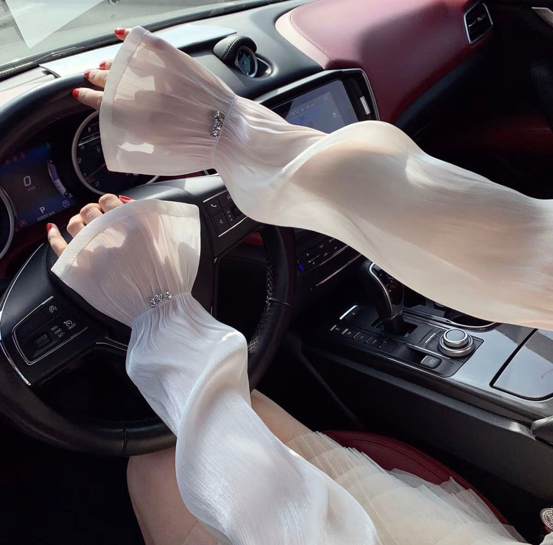 White sheer arm cover while driving